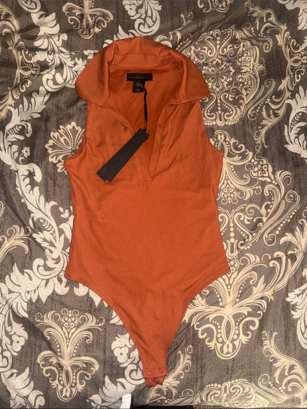 House of Harlow 1960 Sleeveless Ribbed Bodysuit in Rust Orange